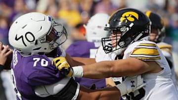 EVANSTON, IL - OCTOBER 21: Anthony Nelson #98 of the Iowa Hawkeyes rushes against Rashawn Slater #70 of the Northwestern Wildcats at Ryan Field on October 21, 2017 in Evanston, Illinois. Northwestern defeated Iowa 17-10 in overtime. (Photo by Jonathan Daniel/Getty Images)