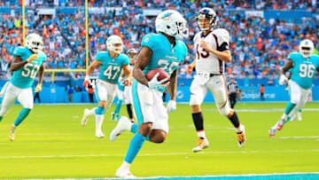 MIAMI GARDENS, FL - DECEMBER 03: Xavien Howard #25 of the Miami Dolphins returns the interception for a touchdown in the second quarter against the Denver Broncos at the Hard Rock Stadium on December 3, 2017 in Miami Gardens, Florida. (Photo by Chris Trotman/Getty Images)
