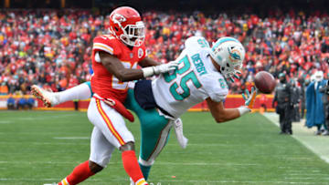 KANSAS CITY, MO - DECEMBER 24: Tight end A.J. Derby #85 of the Miami Dolphins has a ball go off his hands in the end zone missing a scoring chance in front of the coverage by cornerback Eric Murray #21 of the Kansas City Chiefs during the second quarter of the game at Arrowhead Stadium on December 24, 2017 in Kansas City, Missouri. ( Photo by Peter Aiken/Getty Images )