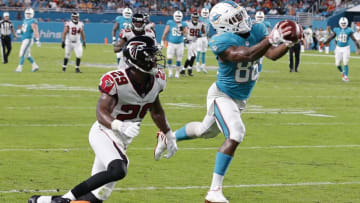 MIAMI GARDENS, FL - AUGUST 10: Leonte Carroo #88 of the Miami Dolphins catches Atlanta Falcons pass for Atlanta Falcons second quarter touchdown pass as C.J. Goodwin #29 of the Atlanta Falcons defends during a preseason game at Hard Rock Stadium on August 10, 2017 in Miami Gardens, Florida. (Photo by Joe Skipper/Getty Images)