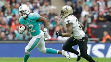 LONDON, ENGLAND - OCTOBER 01: Kenyan Drake of the Miami Dolphins and Kenny Vaccaro of the New Orleans Saints during the NFL game between the Miami Dolphins and the New Orleans Saints at Wembley Stadium on October 1, 2017 in London, England. (Photo by Henry Browne/Getty Images)