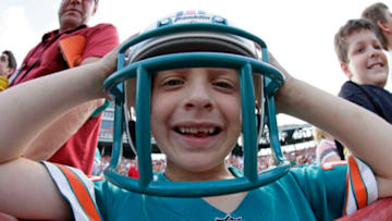 MIAMI, FL - JANUARY 26: Miami Dolphins fan Matthew Suero has on his helmet prior to the start of the game against the Miami Hurricanes at the Orange Bowl January 26, 2008 in Miami, Florida. This is the last game to be played in the Orange Bowl. (Photo by Eliot J. Schechter/Getty Images)