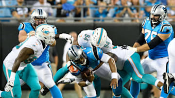 CHARLOTTE, NC - AUGUST 17: Robert Quinn #94 of the Miami Dolphins sacks Cam Newton #1 of the Carolina Panthers in the second quarter during the game at Bank of America Stadium on August 17, 2018 in Charlotte, North Carolina. (Photo by Grant Halverson/Getty Images)