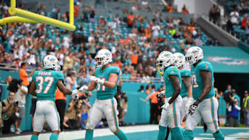 MIAMI, FLORIDA - DECEMBER 22: Miami Dolphins celebrate the touchdown by Myles Gaskin #37 of the Miami Dolphins against the Cincinnati Bengals in the fourth quarter at Hard Rock Stadium on December 22, 2019 in Miami, Florida. (Photo by Mark Brown/Getty Images)