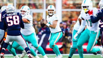 FOXBOROUGH, MA - DECEMBER 29: Ryan Fitzpatrick #14 of the Miami Dolphins looks to throw the football in the first quarter of a game against the New England Patriots at Gillette Stadium on December 29, 2019 in Foxborough, Massachusetts. (Photo by Adam Glanzman/Getty Images)