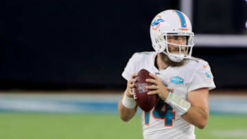 JACKSONVILLE, FLORIDA - SEPTEMBER 24: Ryan Fitzpatrick #14 of the Miami Dolphins attempts a pass during the game against the Jacksonville Jaguars at TIAA Bank Field on September 24, 2020 in Jacksonville, Florida. (Photo by Sam Greenwood/Getty Images)