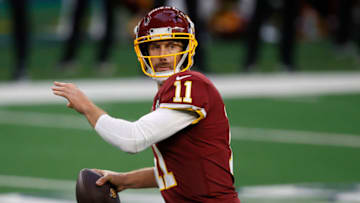 ARLINGTON, TEXAS - NOVEMBER 26: Alex Smith #11 of the Washington Football Team looks to pass during the second quarter of a game against the Dallas Cowboys at AT&T Stadium on November 26, 2020 in Arlington, Texas. (Photo by Tom Pennington/Getty Images)