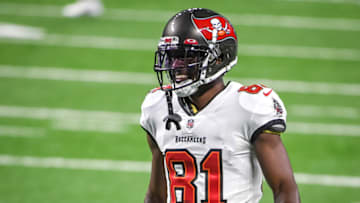 DETROIT, MICHIGAN - DECEMBER 26: Antonio Brown #81 of the Tampa Bay Buccaneers smiles while warming up before the game against the Detroit Lions at Ford Field on December 26, 2020 in Detroit, Michigan. (Photo by Nic Antaya/Getty Images)