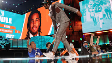CLEVELAND, OHIO - APRIL 29: Jaylen Waddle walks onstage after being selected with the sixth pick by the Miami Dolphins during round one of the 2021 NFL Draft at the Great Lakes Science Center on April 29, 2021 in Cleveland, Ohio. (Photo by Gregory Shamus/Getty Images)