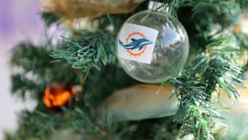 MIAMI GARDENS, FL - DECEMBER 21: A Miami Dolphins ornament is displyed on a Christmas tree in a fan's tent in the parking lot before the Dolphins met the Minnesota Vikings in a game at Sun Life Stadium on December 21, 2014 in Miami Gardens, Florida. (Photo by Rob Foldy/Getty Images)