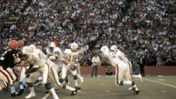 MIAMI, FL - DECEMBER 23: Quarterback Earl Morrall #15, of the Miami Dolphins, turns to hand the ball off during a game on December 23, 1972 against the San Diego Chargers at the Orange Bowl in Miami, Florida. (Photo by: Kidwiler Collection/Diamond Images/Getty Images)