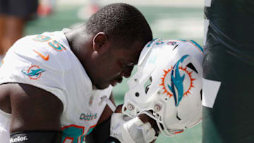 EAST RUTHERFORD, NJ - SEPTEMBER 16: Defensive end William Hayes #95 of the Miami Dolphins takes a moment before the game against the New York Jets at MetLife Stadium on September 16, 2018 in East Rutherford, New Jersey. (Photo by Michael Owens/Getty Images)