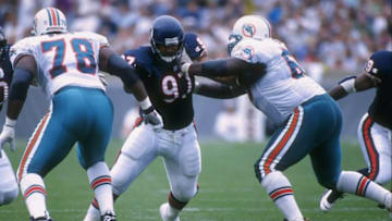 11 Aug 1996: Defensive tackle Chris Zorich #97 of the Chicago Bears attempts to fight through the block of an offensive lineman from the Miami Dolphins during the Bears 24-21 victory over the Dolphins at Soldier Field in Chicago, Illinois. Mandatory Cre