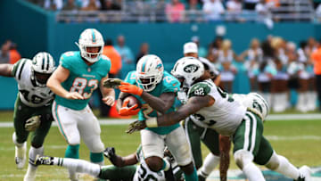 MIAMI, FL - NOVEMBER 04: Frank Gore #21 of the Miami Dolphins carries the ball against the New York Jets in the first half of their game at Hard Rock Stadium on November 4, 2018 in Miami, Florida. (Photo by Mark Brown/Getty Images)