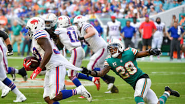 MIAMI, FL - DECEMBER 02: Bobby McCain #28 of the Miami Dolphins makes the tackle on Chris Ivory #33 of the Buffalo Bills during the third quarter against the Buffalo Bills at Hard Rock Stadium on December 2, 2018 in Miami, Florida. (Photo by Mark Brown/Getty Images)