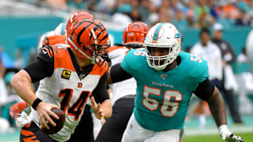 Dec 22, 2019; Miami Gardens, Florida, USA; Cincinnati Bengals quarterback Andy Dalton (14) is pressured by Miami Dolphins defensive tackle Davon Godchaux (56) during the first half at Hard Rock Stadium. Mandatory Credit: Steve Mitchell-USA TODAY Sports