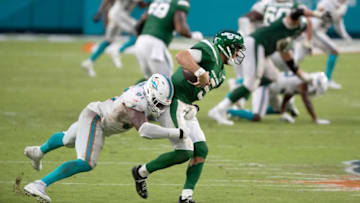 Miami Dolphins defensive end Emmanuel Ogbah (91) sacks New York Jets quarterback Joe Flacco (5) at Hard Rock Stadium in Miami Gardens, October 18, 2020. [ALLEN EYESTONE/The Palm Beach Post]
