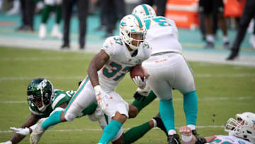 Miami Dolphins running back Myles Gaskin (37) follows blockers against the New York Jets at Hard Rock Stadium in Miami Gardens, October 18, 2020. [ALLEN EYESTONE/The Palm Beach Post]