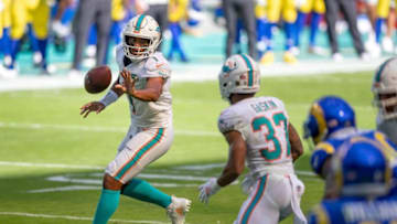 Miami Dolphins quarterback Tua Tagovailoa (1) throws a shovel pass to Miami Dolphins running back Myles Gaskin (37) at Hard Rock Stadium in Miami Gardens, November 1, 2020. (ALLEN EYESTONE / THE PALM BEACH POST)