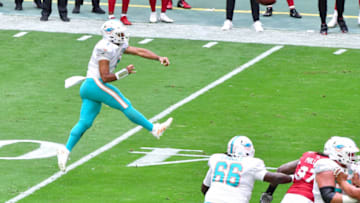 Nov 8, 2020; Glendale, Arizona, USA; Miami Dolphins quarterback Tua Tagovailoa (1) throws against the Arizona Cardinals during the first half at State Farm Stadium. Mandatory Credit: Matt Kartozian-USA TODAY Sports