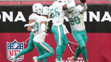 Miami Dolphins defensive end Shaq Lawson (90) celebrates with teammates after recovering a fumble for a touchdown against the Arizona Cardinals during the first quarter in Glendale, Ariz. November 8, 2020.Miami Dolphins Vs Arizona Cardinals