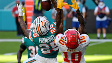 Dec 13, 2020; Miami Gardens, Florida, USA; Miami Dolphins cornerback Xavien Howard (25) makes a one handed catch to intercept a pass intended for Kansas City Chiefs wide receiver Tyreek Hill (10) during the second half at Hard Rock Stadium. Mandatory Credit: Jasen Vinlove-USA TODAY Sports