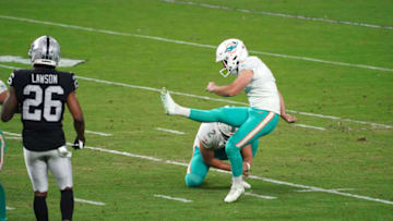 Dec 26, 2020; Paradise, Nevada, USA; Miami Dolphins kicker Jason Sanders (7) follows through on a 44-yard field goal out of the hold of punter Matt Haack (2) with a second to play against the Las Vegas Raiders at Allegiant Stadium. The Dolphins defeated the Raiders 26-25. Mandatory Credit: Kirby Lee-USA TODAY Sports