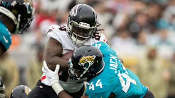 Nov 28, 2021; Jacksonville, Florida, USA; Jacksonville Jaguars linebacker Myles Jack (44) tackles Atlanta Falcons running back Cordarrelle Patterson (84) during the second half at TIAA Bank Field. Mandatory Credit: Matt Pendleton-USA TODAY Sports