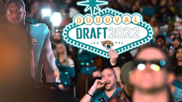 A Jaguars fan in the crowd holds a DUUUVAL Draft sign during the team's NFL Draft party Thursday evening. Jacksonville Jaguar fans showed up at Daily's Place for the 2022 NFL Draft party which saw the Jaguars pick University of Georgia edge rusher Travon Walker as their first pick of the draft where the team had the first overall draft pick Thursday evening, April 28, 2022. [Bob Self/Florida Times-Union]Jki 042822 Jags2022draftpa 11