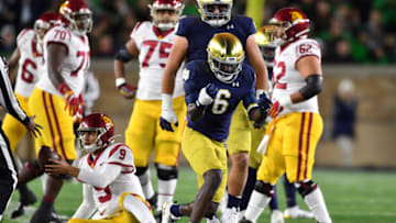 Oct 12, 2019; South Bend, IN, USA; Notre Dame Fighting Irish defensive back Jeremiah Owusu-Koramoah (6) celebrates after sacking USC Trojans quarterback Kedon Slovis (9) in the first quarter at Notre Dame Stadium. Mandatory Credit: Matt Cashore-USA TODAY Sports