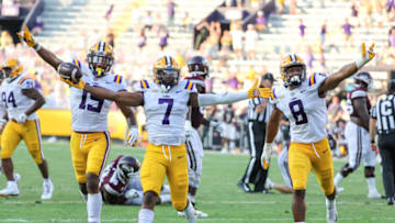 Sep 26, 2020; Baton Rouge, Louisiana, USA; LSU Tigers safety JaCoby Stevens (7) celebrates with linebacker Jabril Cox (19) and linebacker BJ Ojulari (8) after a turnover against the Mississippi State Bulldogs during the second half at Tiger Stadium. Mandatory Credit: Derick E. Hingle-USA TODAY Sports