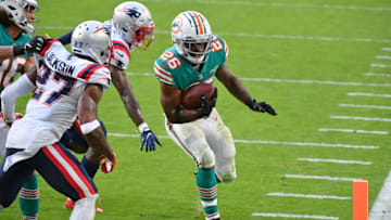 Dec 20, 2020; Miami Gardens, Florida, USA; Miami Dolphins running back Salvon Ahmed (26) scores on a two-point conversion attempt during the second half against the New England Patriots at Hard Rock Stadium. Mandatory Credit: Jasen Vinlove-USA TODAY Sports