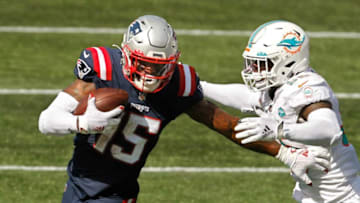 Published Caption: Patriots receiver N’Keal Harry fends off Dolphins defender Jerome Baker after a third-quarter reception in Week 1. [The Providence Journal / Kris Craig] Original Caption: Patriots receiver N'Keal Harry fends off Dolphins defender Jerome Baker after a third-quarter reception in Week 1.Patriots Expecting More From N Keal Harry