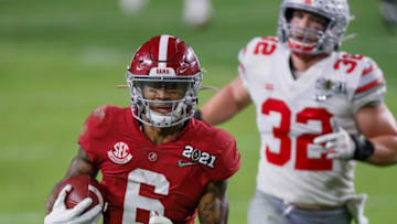 Alabama receiver DeVonta Smith catches a 42-yard touchdown behind Ohio State linebacker Tuf Borland during the second quarter of the College Football Playoff National Championship Game, Jan. 11, 2021 in Miami Gardens, Fla.Ncaa Football Cfp National Championship Ohio State Vs Alabama