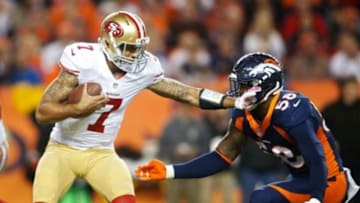 Oct 19, 2014; Denver, CO, USA; San Francisco 49ers quarterback Colin Kaepernick (7) under pressure from Denver Broncos outside linebacker Von Miller (58) during the game at Sports Authority Field at Mile High. Mandatory Credit: Chris Humphreys-USA TODAY Sports