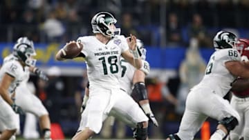 Dec 31, 2015; Arlington, TX, USA; Michigan State Spartans quarterback Connor Cook (18) in action against Alabama Crimson Tide in the second half of the 2015 CFP semifinal at the Cotton Bowl at AT&T Stadium. Mandatory Credit: Matthew Emmons-USA TODAY Sports