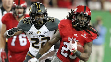 Sep 12, 2015; Jonesboro, AR, USA; Arkansas State Red Wolves wide receiver J.D. McKissic (23) runs after a catch in the fourth quarter as Missouri Tigers defensive back Anthony Sherrils (22) closes in at ASU Stadium. Missouri defeated Arkansas State 27-20. Mandatory Credit: Nelson Chenault-USA TODAY Sports