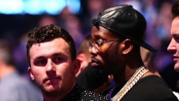 March 5, 2016; Las Vegas, NV, USA; NFL players Johnny Manziel and Von Miller attend the match between Nate Diaz and Conor McGregor during UFC 196 at MGM Grand Garden Arena. Mandatory Credit: Mark J. Rebilas-USA TODAY Sports