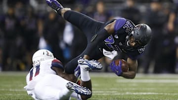 Oct 31, 2015; Seattle, WA, USA; Arizona Wildcats safety Will Parks (11) makes the tackle on Washington Huskies tight end Joshua Perkins (82) during the second quarter at Husky Stadium. Mandatory Credit: Jennifer Buchanan-USA TODAY Sports