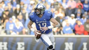 Nov 29, 2014; Memphis, TN, USA; Memphis Tigers quarterback Paxton Lynch (12) runs with the ball against the Connecticut Huskies during the game at Liberty Bowl Memorial Stadium. Mandatory Credit: Justin Ford-USA TODAY Sports