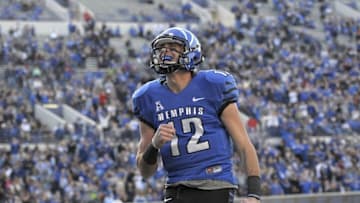 Nov 22, 2014; Memphis, TN, USA; Memphis Tigers quarterback Paxton Lynch (12) celebrates after scoring a touchdown during the game against the South Florida Bulls at Liberty Bowl Memorial Stadium. Memphis Tigers beat South Florida Bulls 31-20. Mandatory Credit: Justin Ford-USA TODAY Sports