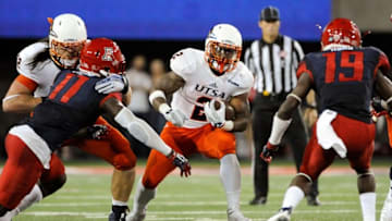 Sep 3, 2015; Tucson, AZ, USA; Texas-San Antonio Roadrunners running back Jarveon Williams (2) runs the ball under pressure from Arizona Wildcats safety Will Parks (11) and cornerback DaVonte