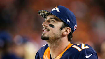 Oct 24, 2016; Denver, CO, USA; Denver Broncos quarterback Paxton Lynch (12) looks on in the third quarter against the Houston Texans at Sports Authority Field at Mile High. The Broncos won 27-9. Mandatory Credit: Isaiah J. Downing-USA TODAY Sports