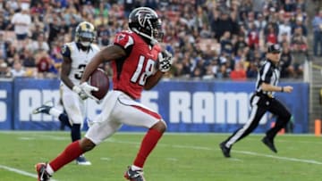Dec 11, 2016; Los Angeles, CA, USA; Atlanta Falcons wide receiver Taylor Gabriel (18) scores on a 64-yard touchdown reception in the third quarter against the Los Angeles Rams at Los Angeles Memorial Coliseum. Mandatory Credit: Kirby Lee-USA TODAY Sports