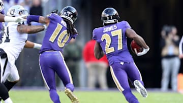 BALTIMORE, MARYLAND - NOVEMBER 25: Cornerback Cyrus Jones #27 of the Baltimore Ravens returns a punt for a touchdown in the second quarter against the Oakland Raiders at M&T Bank Stadium on November 25, 2018 in Baltimore, Maryland. (Photo by Patrick Smith/Getty Images)