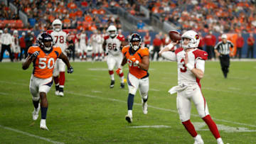 DENVER, CO - AUGUST 29: Quarterback Drew Anderson #3 of the Arizona Cardinals throws a pass as linebackers Aaron Wallace #50 and Ahmad Gooden #94 of the Denver Broncos give chase during the third quarter of a preseason game at Broncos Stadium at Mile High on August 29, 2019 in Denver, Colorado. (Photo by Justin Edmonds/Getty Images)