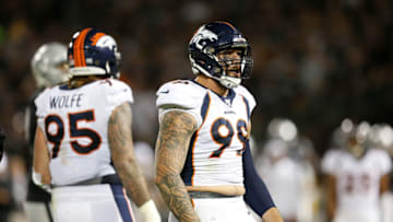 OAKLAND, CALIFORNIA - SEPTEMBER 09: Adam Gotsis #99 of the Denver Broncos celebrates after making a tackle for a loss on Josh Jacobs #28 of the Oakland Raiders in the second quarter of the game at RingCentral Coliseum on September 09, 2019 in Oakland, California. (Photo by Lachlan Cunningham/Getty Images)