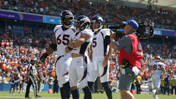 CARSON, CALIFORNIA - OCTOBER 06: Phillip Lindsay #30 of the Denver Broncos celebrates a touchdown with Ronald Leary #65 and Joe Flacco #5 in the first quarter against the Los Angeles Chargers at Dignity Health Sports Park on October 06, 2019 in Carson, California. (Photo by Jeff Gross/Getty Images)