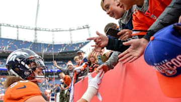 DENVER, CO - NOVEMBER 3: Phillip Lindsay #30 of the Denver Broncos has a word with young fans during warm ups before a game against the Cleveland Browns at Empower Field at Mile High on November 3, 2019 in Denver, Colorado. (Photo by Dustin Bradford/Getty Images)