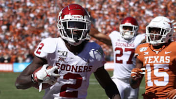 DALLAS, TEXAS - OCTOBER 12: CeeDee Lamb #2 of the Oklahoma Sooners runs for a touchdown against the Texas Longhorns in the third quarter during the 2019 AT&T Red River Showdown at Cotton Bowl on October 12, 2019 in Dallas, Texas. (Photo by Ronald Martinez/Getty Images)